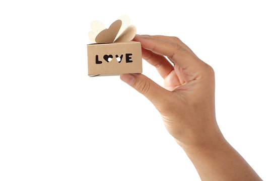 Hand holding eco paper box with heart shape isolated clipping path