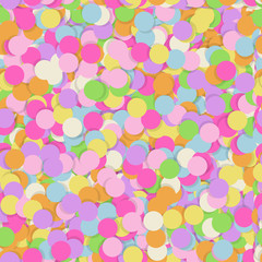 Festive seamless pattern with confectionery sprinkling. Random mess repeated texture of pink, yellow, purple color. Bright and colorful vector background.
