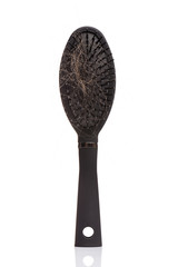 Hair loss problem - black hair comb brush with lost hair on it, isolated white background. Full depth of field with clipping path.