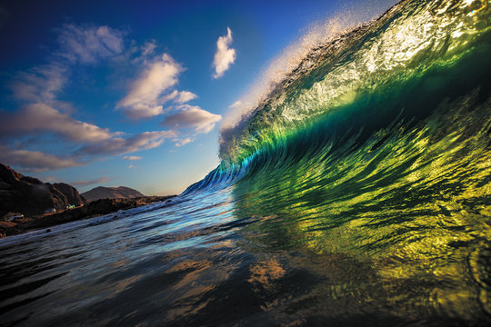 Vibrant green ocean wave rip curl rising