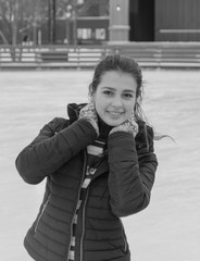 closeup on the rink an attractive girl posing, black and white.