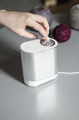 woman turn on air humidifier