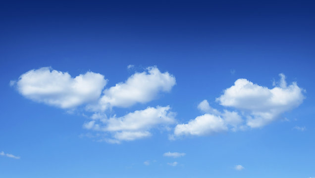 The blue sky with clouds, background.Blue sky background with tiny clouds