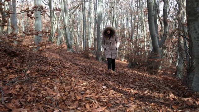 beautiful girl walking in autumn forest, 4K UHD,