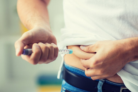 Man With Syringe Making Insulin Injection