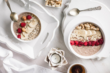 Smoothie in a bowl with fruits and seeds. Healthy breakfast.