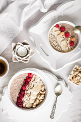 Smoothie in a bowl with fruits and seeds. Healthy breakfast.