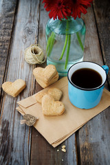  Valentine's cookies  with coffee on texture background
