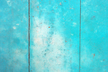 The bright retro blue color old door texture, grunge background with free space.
