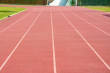 Fototapeta premium A stadium is a place for outdoor sports consists of a field or stage either partly or completely surrounded by a tiered structure designed to allow spectators to stand or sit and view the event.