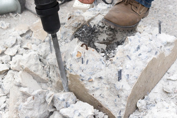 Drilling hole into concrete - 134605153