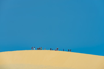 MUI NE - VIETNAM, JANUARY 14, 2017 : Tourists enjoy on the desert by jeep car in Mui ne, January 14, 2017