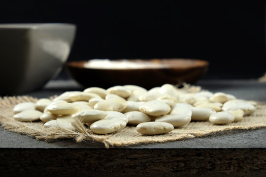 Dried white beans on sackcloth.