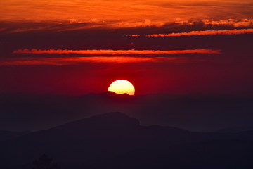 Big sun and Mist in sunrise,Sun on Sunrise,sun and mist on mountian,Morning,Sun on during sunrise,White balace orange on sunrise