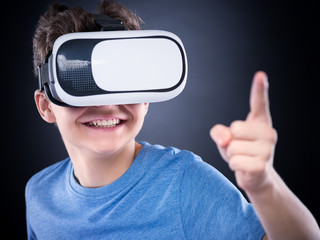 Teen boy in VR glasses