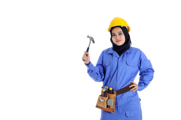 Construction worker wear yellow safety helmet in action while holding a hammer