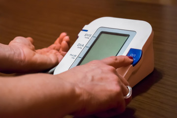 Woman is taking care for health with hearth beat monitor and blood pressure