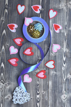felt heart and ribbon bow on wood as valentines decoration