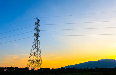 Fototapeta premium high voltage post,Electricity pylons and lines at sunset.