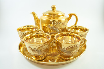 Fototapeta na wymiar Luxury golden Chinese teapot set with cup