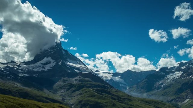 timelapse of the amazing matterhorn and surrounding mountains in the Swiss Alps with fantastic cloud formations