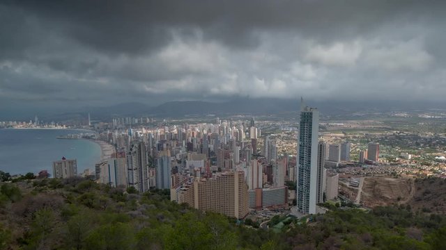 timelapse of the coast and high rise skyline of benidorm seaside resort, shot from a high vantage point, spain