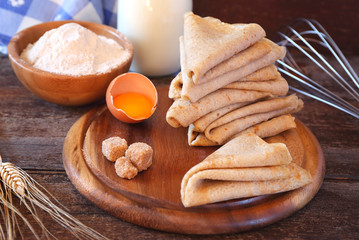 Pancakes and ingredients: flour, milk, sugar