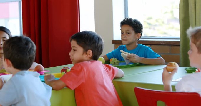 Kids having meal in school cafeteria 4k