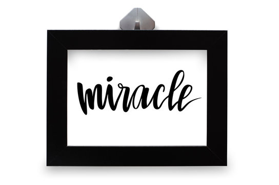 Black photo frame. The inscription miracle