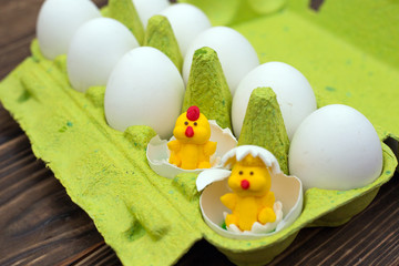 two small chicken hatched from an egg at Easter