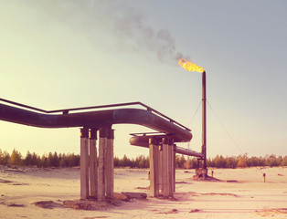 Industrial landscape. Gas Torch..Flaring of associated gas during oil production.