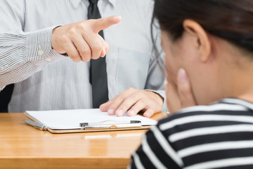 Businesswoman getting intimidated after scolded by boss
