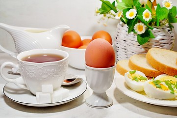 Easter- traditional Easter breakfast - Festive Easter table in white - soft focus, selective focus