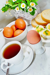 Easter- traditional Easter breakfast - Festive Easter table in white - soft focus, selective focus