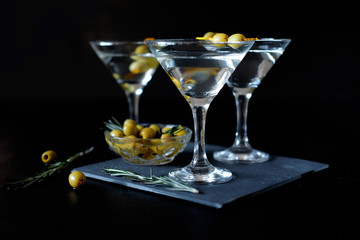 Margarita cocktail alcohol drink in glass with green olives