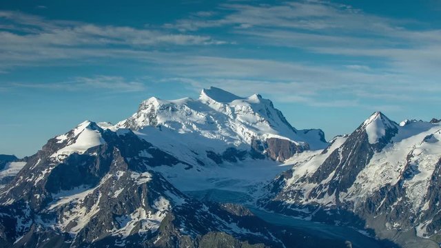 stunning timelapse in the early morning as the sun rises over the mountain peaks from the mont fort viewing point in verbier, swiss alps