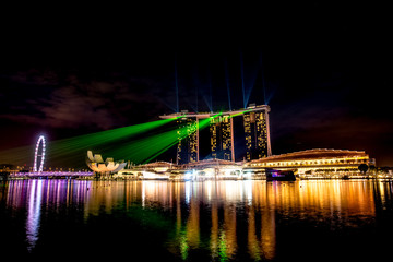 Singapore city at night with laser show