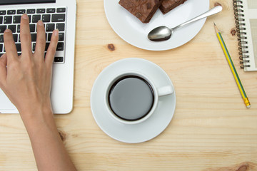top view of coffee cup on wooden table