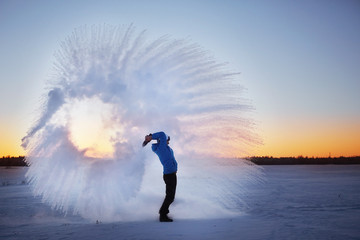 frost effect hot water freezes man pours boiling water