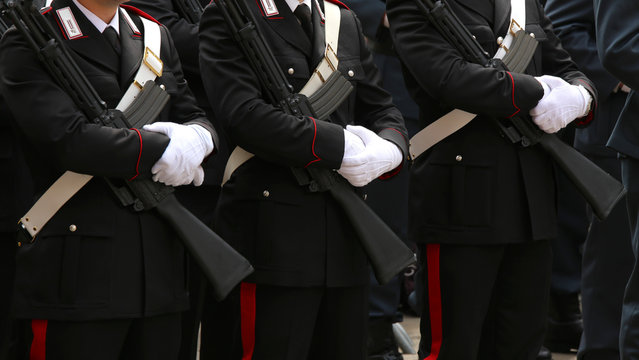 three italian police in full uniform of Carabinieri Army
