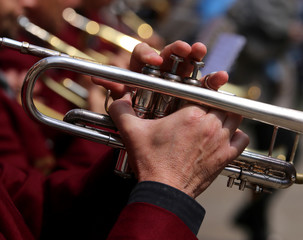 trumpet player during an outdoor exhibition of a brass band