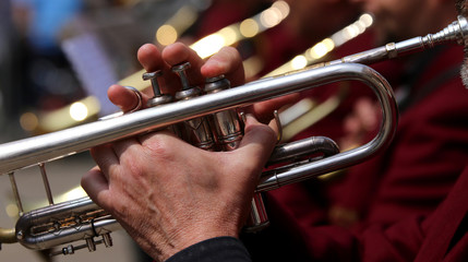 trumpet player during an outdoor concert of a brass band