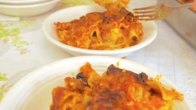 the lasagne portions on plates