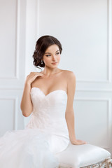 Fototapeta na wymiar Beautiful bride. Wedding hairstyle make-up luxury fashion dress concept