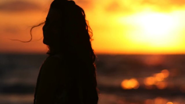 woman in the sunset with silhouette 