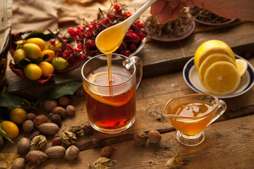 Hot tea with lemon and honey, good treat to have vitamins and strong immunity.