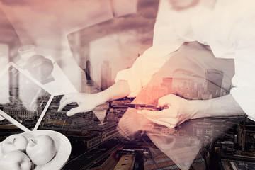 double exposure of hipster hand using digital tablet docking key