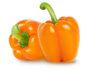 Two bell peppers of orange color isolated on white background