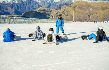 Snowboarder instructor teaching apprentice learners special tricks and skills © DisobeyArt