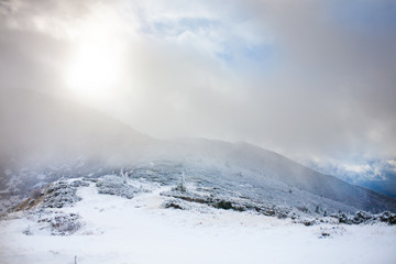 Fototapeta na wymiar Winter mountains in a fog.